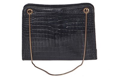Lot 45 - A Cartier black crocodile handbag, 1959