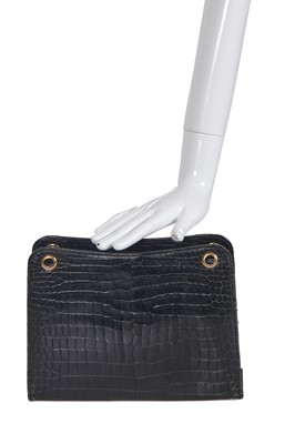 Lot 45 - A Cartier black crocodile handbag, 1959