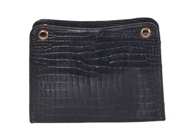 Lot 45 - A Cartier black crocodile handbag, 1959