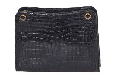 Lot 45 - A Cartier black crocodile handbag, 1959