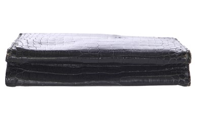 Lot 45 - A Cartier black crocodile handbag, 1959