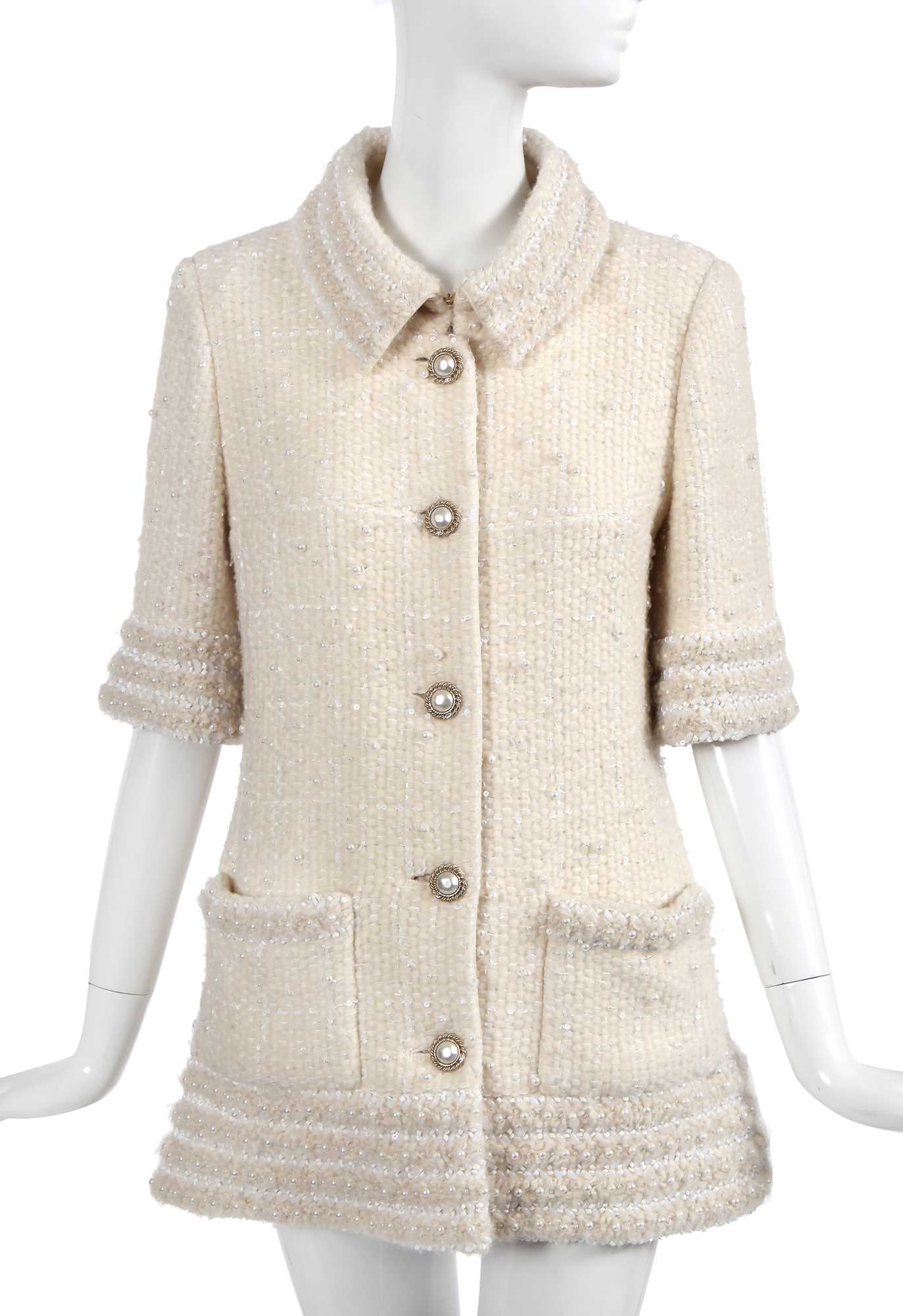 Lot 8 - A fine Chanel by Karl Lagerfeld ivory tweed jacket, 'Paris-Hamburg' collection, Métiers d'Art, Pre-Fall 2018