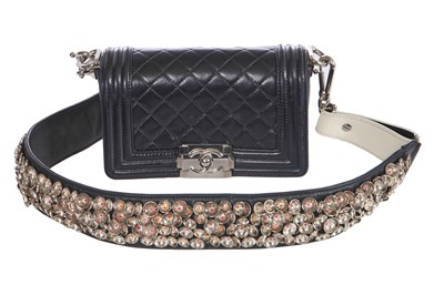 Lot 24 - A Chanel by Karl Lagerfeld black leather Boy bag with embellished strap, 'Paris-Bombay' collection, Métiers d'Art, Pre-Fall 2012