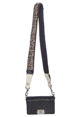 Lot 24 - A Chanel by Karl Lagerfeld black leather Boy bag with embellished strap, 'Paris-Bombay' collection, Métiers d'Art, Pre-Fall 2012