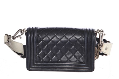 Lot 24 - A Chanel by Karl Lagerfeld black leather Boy bag with embellished strap, 'Paris-Bombay' collection, Métiers d'Art, Pre-Fall 2012