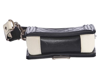 Lot 24 - A Chanel by Karl Lagerfeld black leather Boy bag with embellished strap, 'Paris-Bombay' collection, Métiers d'Art, Pre-Fall 2012