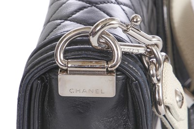 Lot 24 - A Chanel by Karl Lagerfeld black leather Boy bag with embellished strap, 'Paris-Bombay' collection, Métiers d'Art, Pre-Fall 2012