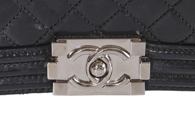 Lot 24 - A Chanel by Karl Lagerfeld black leather Boy bag with embellished strap, 'Paris-Bombay' collection, Métiers d'Art, Pre-Fall 2012