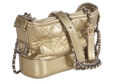 Lot 10 - A Chanel by Karl Lagerfeld small gold leather Gabrielle hobo bag, circa 2017