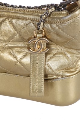 Lot 10 - A Chanel by Karl Lagerfeld small gold leather Gabrielle hobo bag, circa 2017