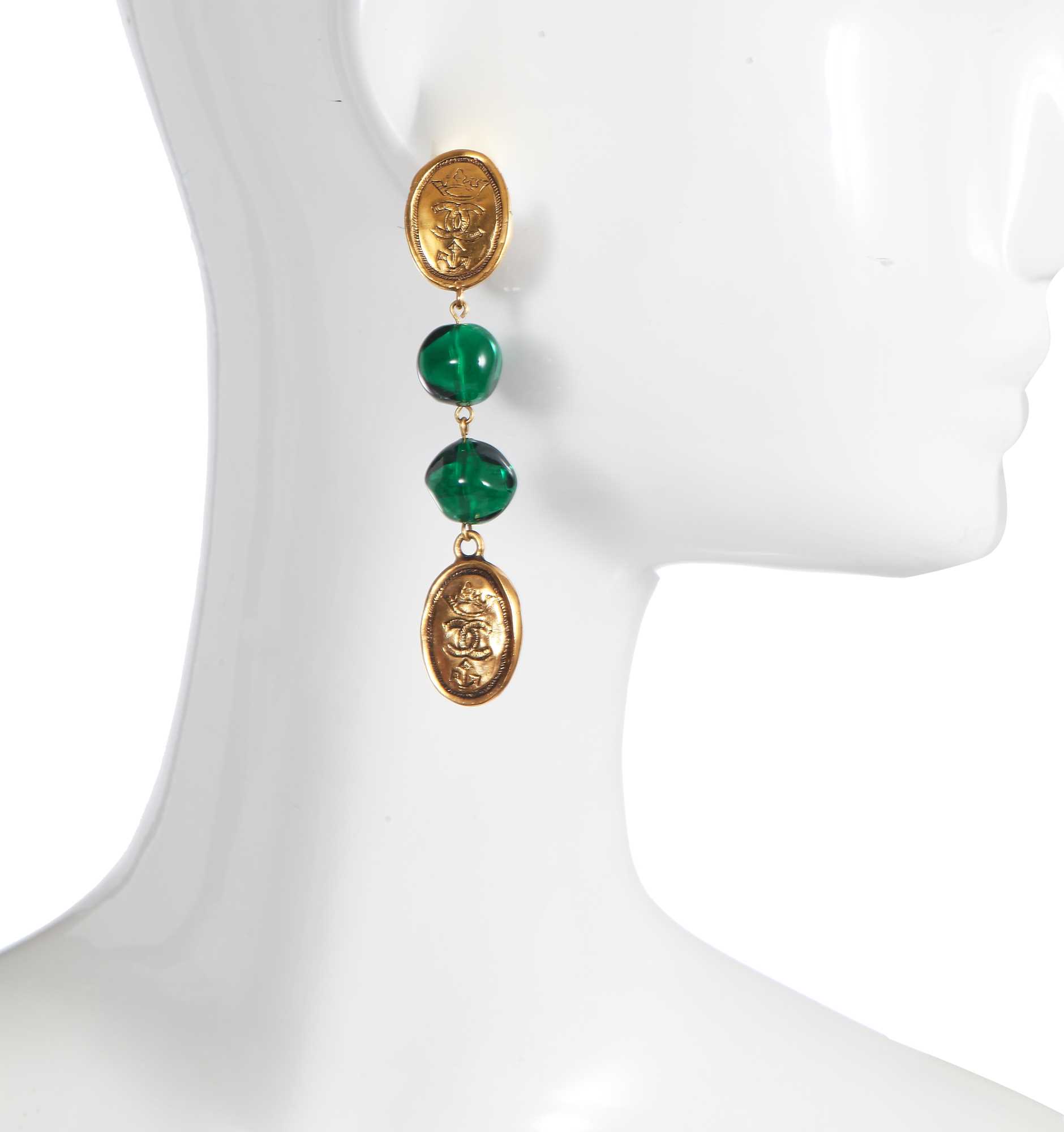 Lot 32 - A pair of Chanel gold-tone and green glass earrings, circa 1990