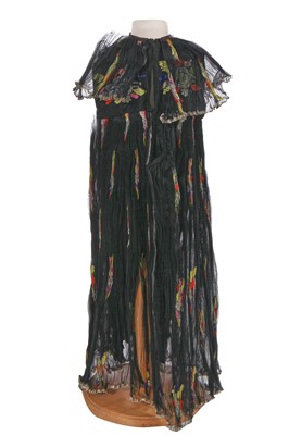 Lot 645 - A rare Thea Porter black and multicoloured floral silk child's dress, 1970s