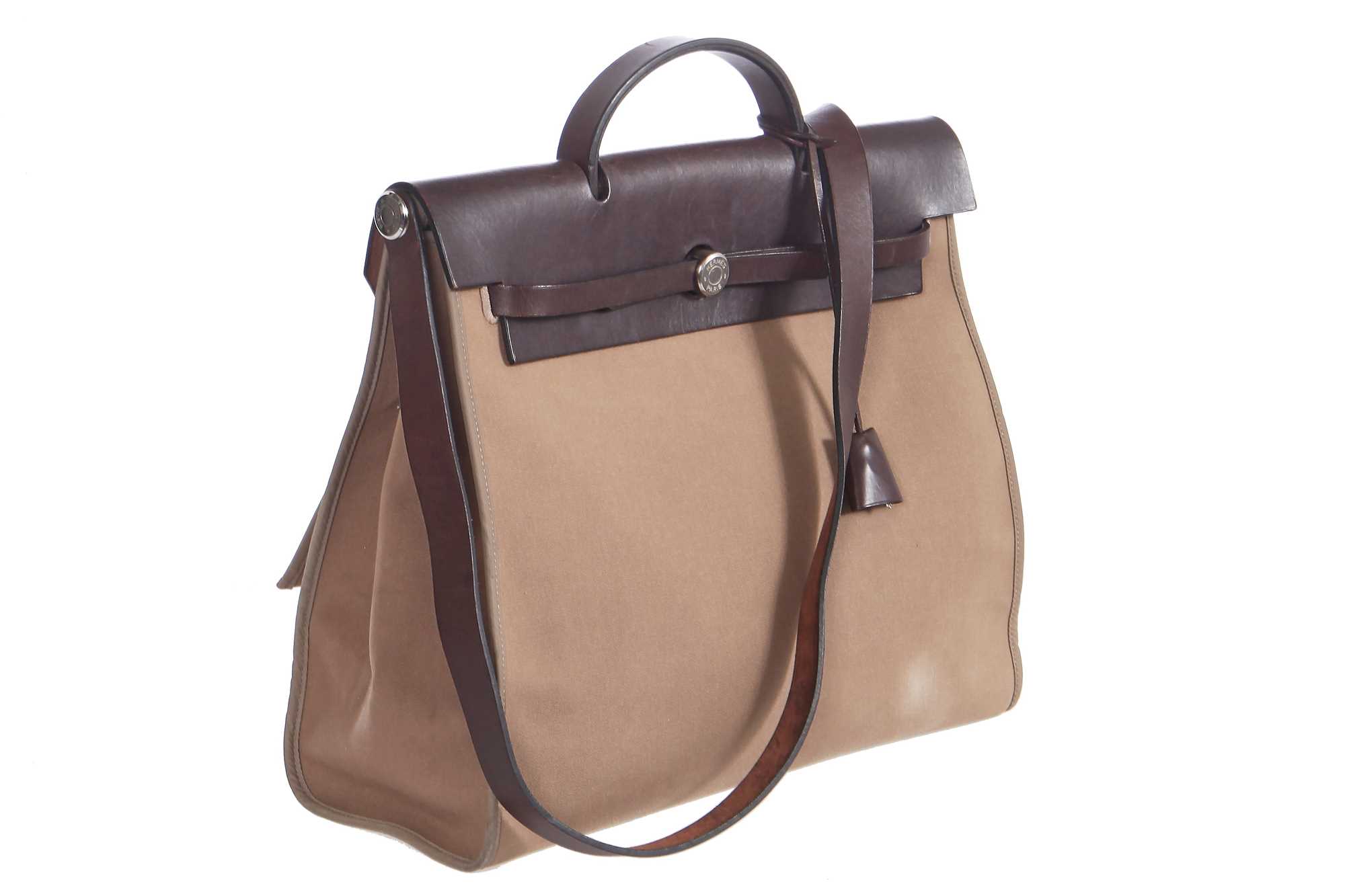 Lot 48 - An Hermès brown leather and canvas Herbag Zip 39, 2010