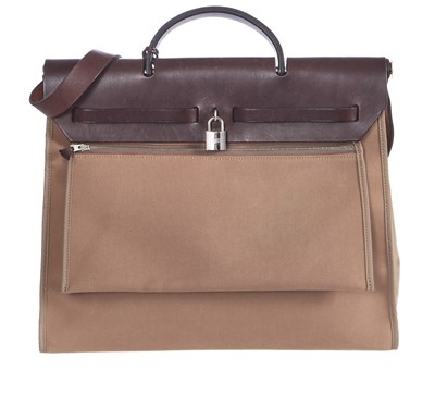 Lot 48 - An Hermès brown leather and canvas Herbag Zip 39, 2010
