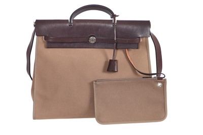 Lot 48 - An Hermès brown leather and canvas Herbag Zip 39, 2010