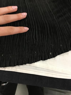 Lot 455 - A Mariano Fortuny black silk Delphos, circa 1920-30