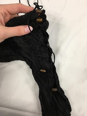 Lot 455 - A Mariano Fortuny black silk Delphos, circa 1920-30