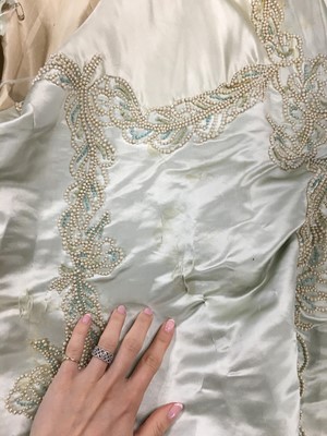 Lot 484 - A Charles Frederick Worth eau de nil satin evening gown, 1893-4