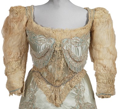 Lot 484 - A Charles Frederick Worth eau de nil satin evening gown, 1893-4