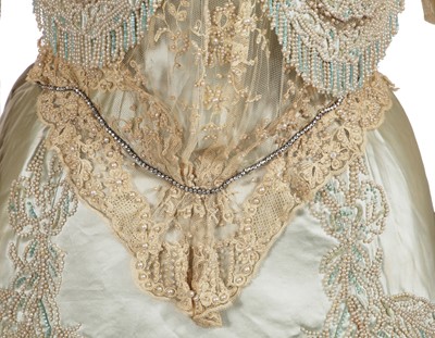 Lot 484 - A Charles Frederick Worth eau de nil satin evening gown, 1893-4