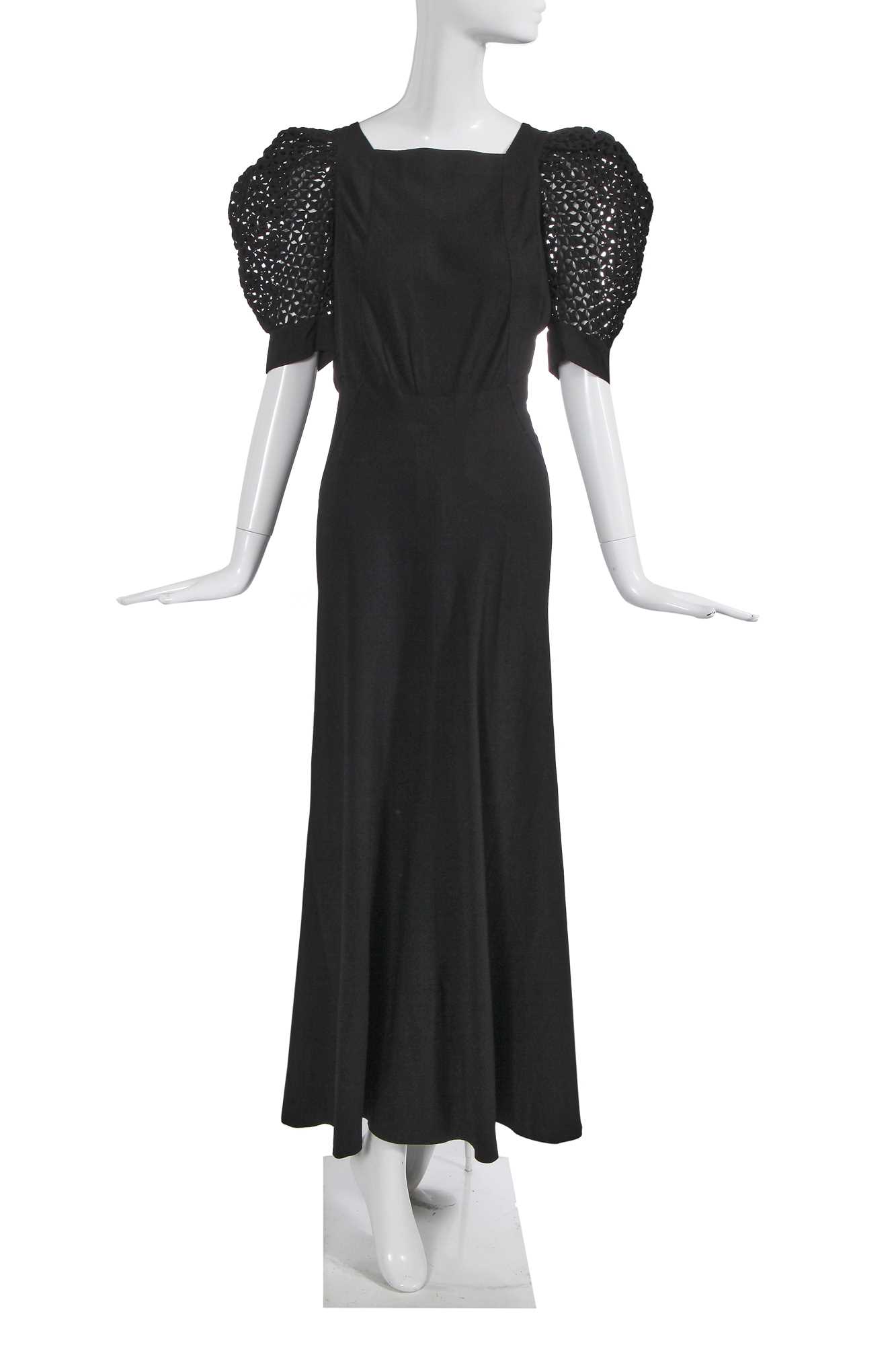 Lot 448 - A Nina Ricci black silk evening dress, late 1930s