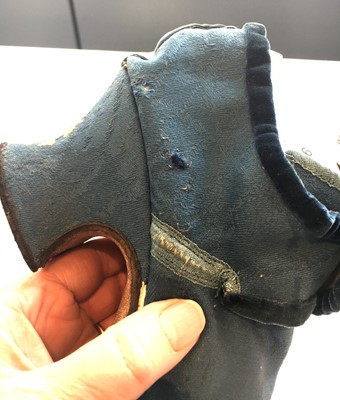 Lot 536 - A pair of blue wool damask shoes, circa 1720