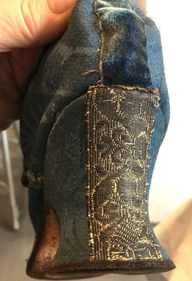 Lot 536 - A pair of blue wool damask shoes, circa 1720