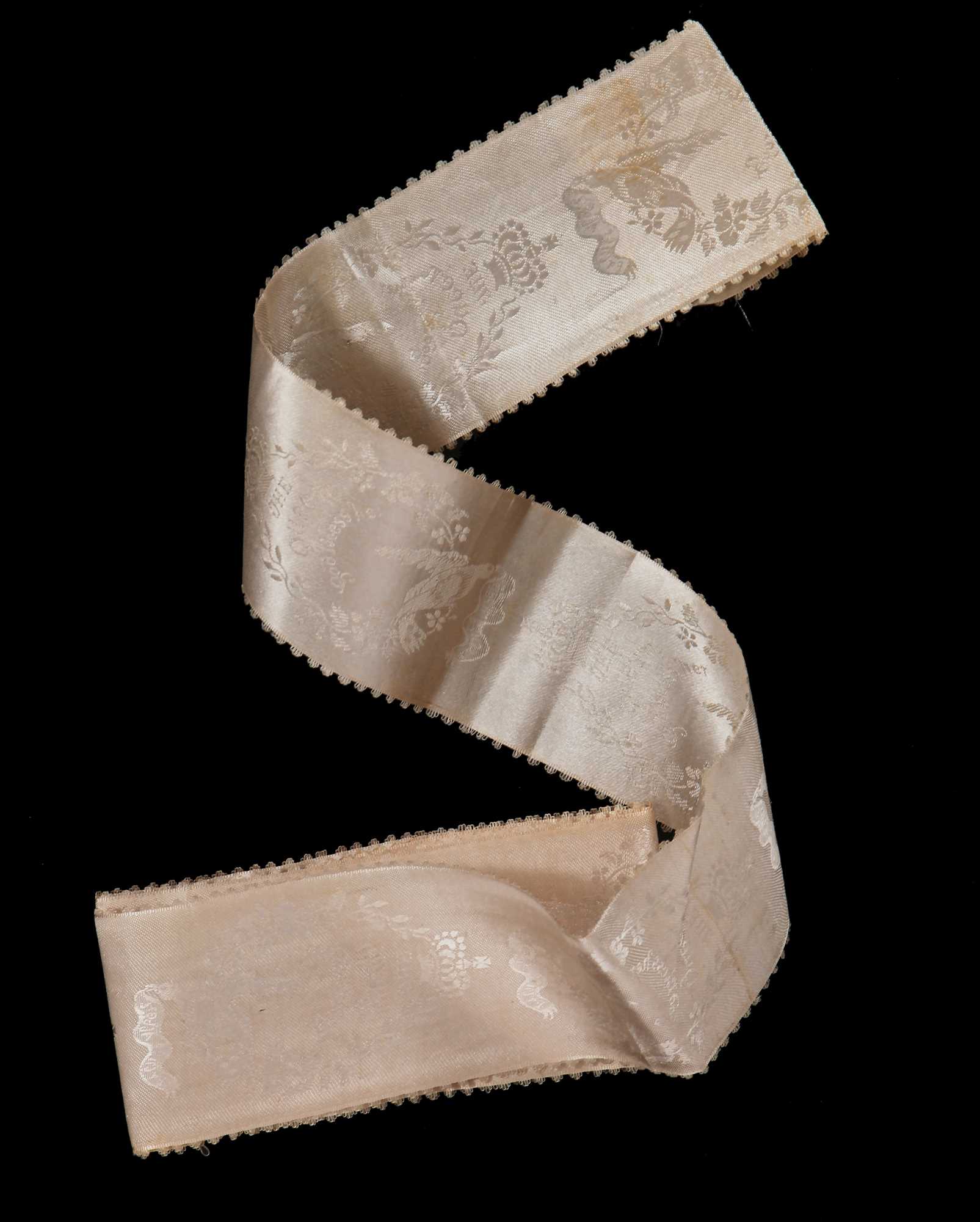 Lot 867 - An ivory satin ribbon probably woven to commemorate the wedding of Queen Victoria in 1840