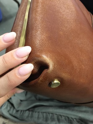 Lot 243 - An Alexander McQueen brown leather handbag, 2010s