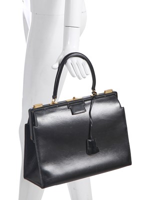 Lot 47 - An Hermès black leather 'Model 404' handbag, early 1960s