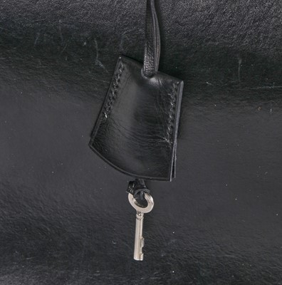 Lot 47 - An Hermès black leather 'Model 404' handbag, early 1960s