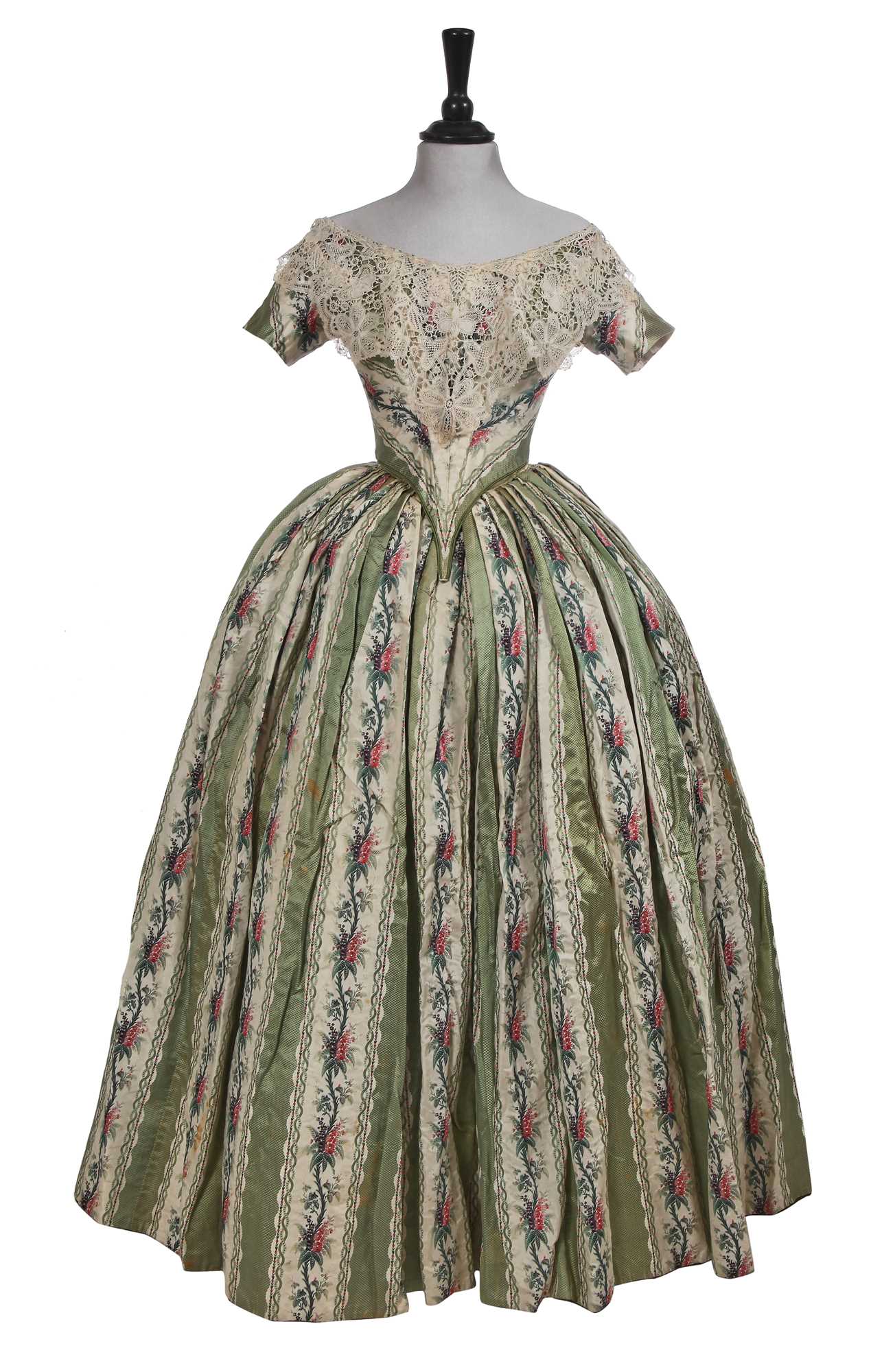 Lot 498 - A fine green striped and floral brocaded gown with day and evening bodices, circa 1854