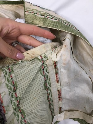 Lot 498 - A fine green striped and floral brocaded gown with day and evening bodices, circa 1854