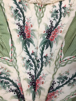 Lot 498 - A fine green striped and floral brocaded gown with day and evening bodices, circa 1854