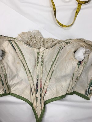 Lot 498 - A fine green striped and floral brocaded gown with day and evening bodices, circa 1854