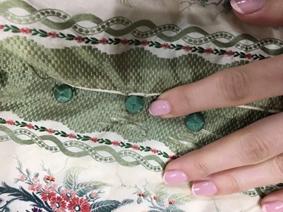 Lot 498 - A fine green striped and floral brocaded gown with day and evening bodices, circa 1854