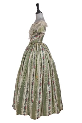 Lot 498 - A fine green striped and floral brocaded gown with day and evening bodices, circa 1854
