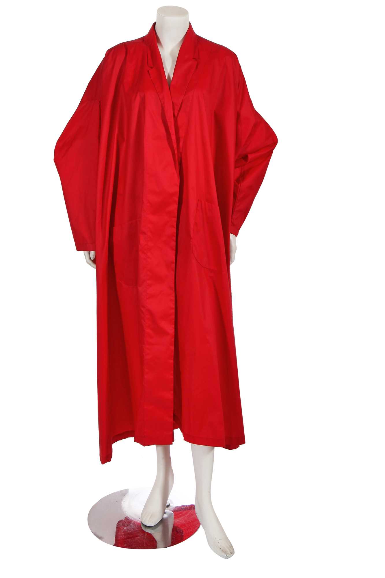 Lot 614 - A Norma Kamali red polyester parachute coat, 1980s