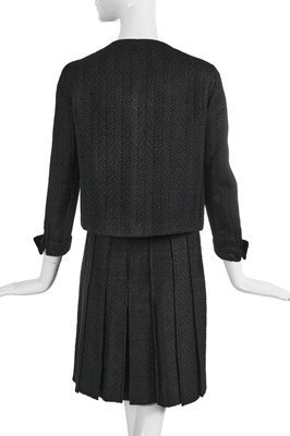 Lot 37 - A Gabrielle Chanel haute couture black herringbone silk suit, circa 1965
