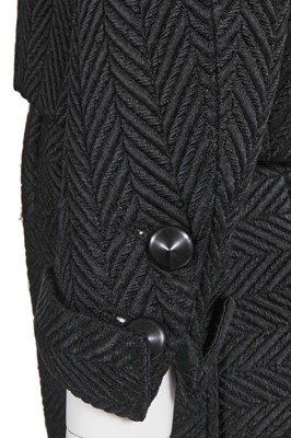 Lot 37 - A Gabrielle Chanel haute couture black herringbone silk suit, circa 1965