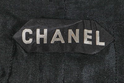 Lot 37 - A Gabrielle Chanel haute couture black herringbone silk suit, circa 1965