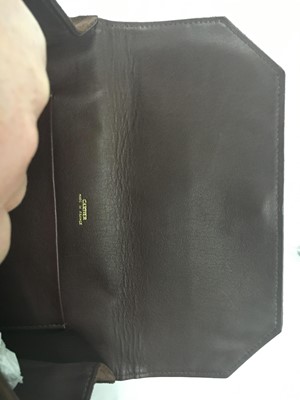 Lot 42 - A Cartier brown suede bag, 1936
