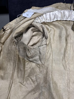 Lot 182 - An embroidered green silk coat and waistcoat, 1780s