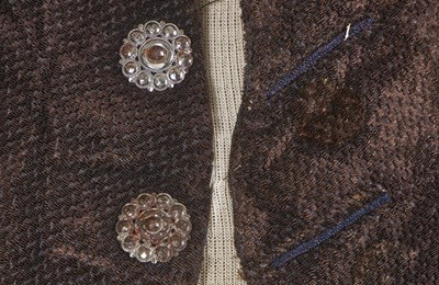 Lot 179 - A voided velvet coat and a bicorne, 1780-1810s