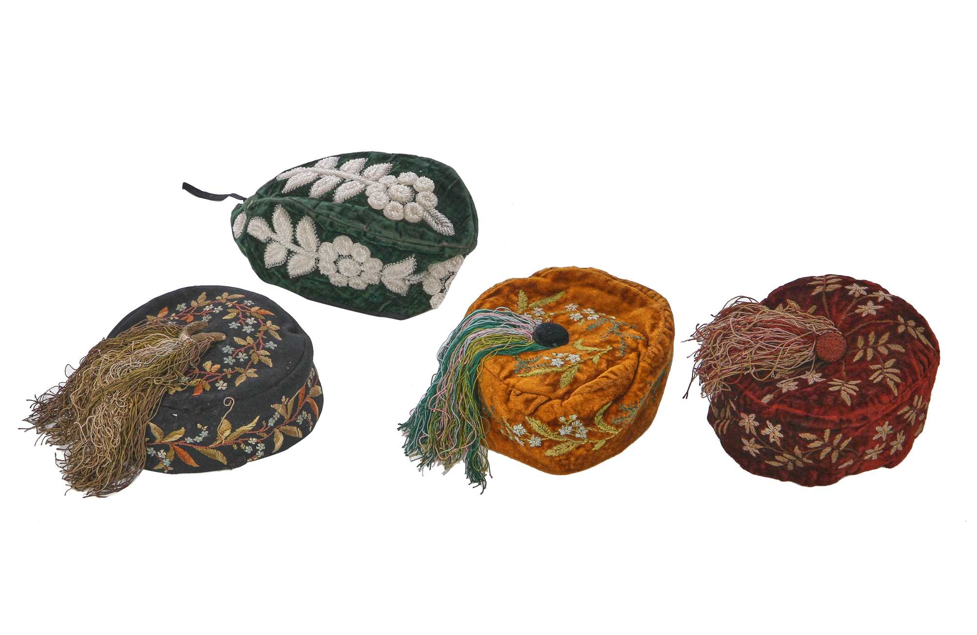 Lot 173 - A group of embroidered smoking and Argyll caps, late 1870s-1880s