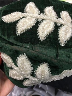 Lot 173 - A group of embroidered smoking and Argyll caps, late 1870s-1880s