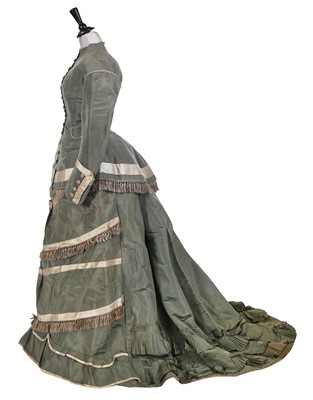 Lot 841 - A contrasting aquamarine silk and grey satin reception gown, circa 1875