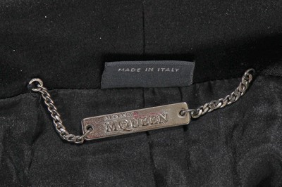 Lot 378 - An Alexander McQueen black silk faille jacket, commercial collection 2006