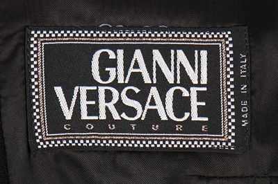 Lot 79 - A Gianni Versace bondage-style black wool...