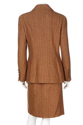 Lot 104 - A Chanel herringbone tweed suit, Autumn-Winter...